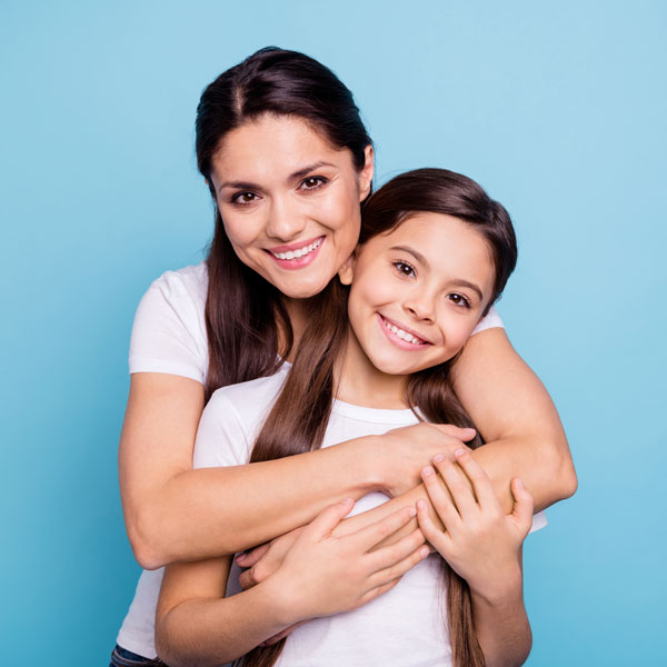 smiling mom and daughter